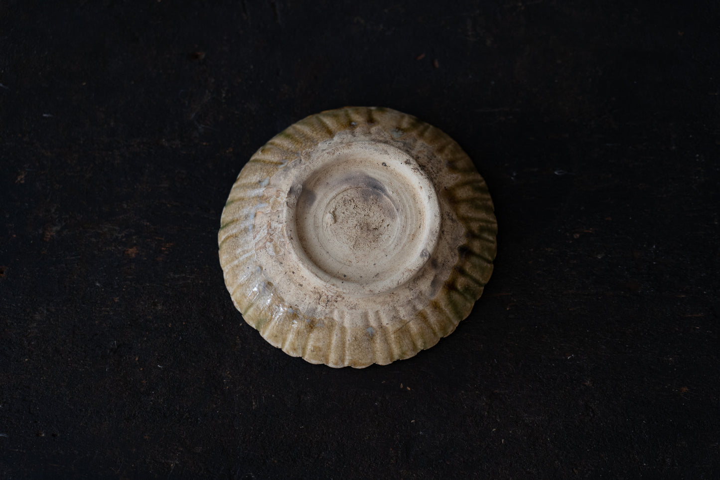 A set of five Oribe green glazed dishes in chrysanthemum design