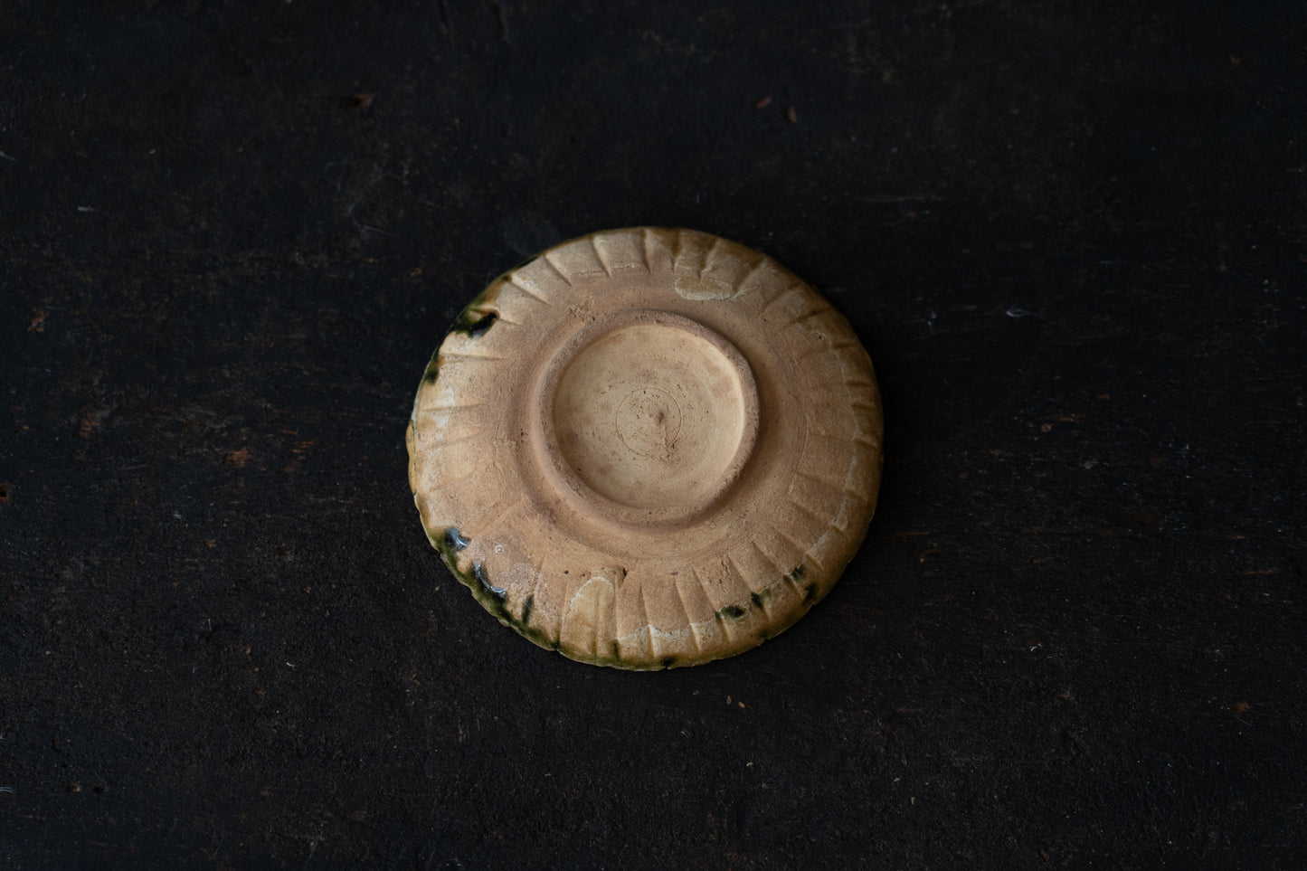 A set of five Oribe green glazed dishes in chrysanthemum design