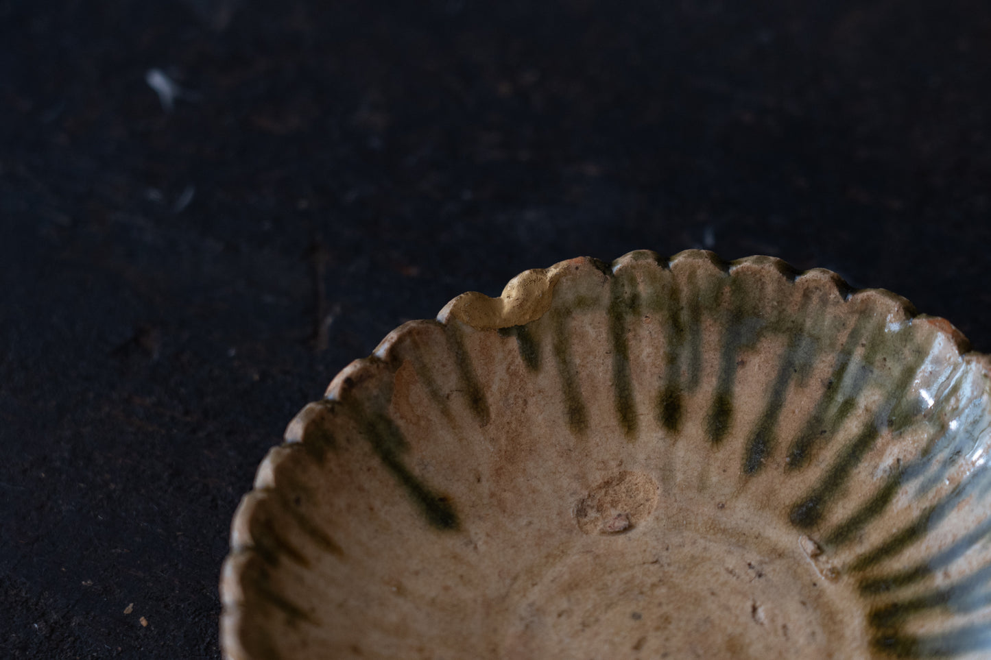 A set of five Oribe green glazed dishes in chrysanthemum design