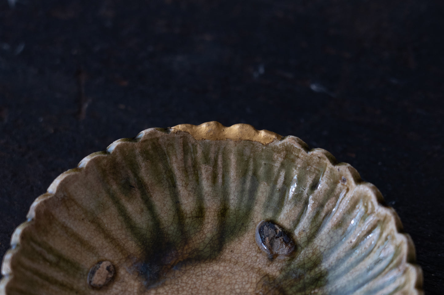 A set of five Oribe green glazed dishes in chrysanthemum design