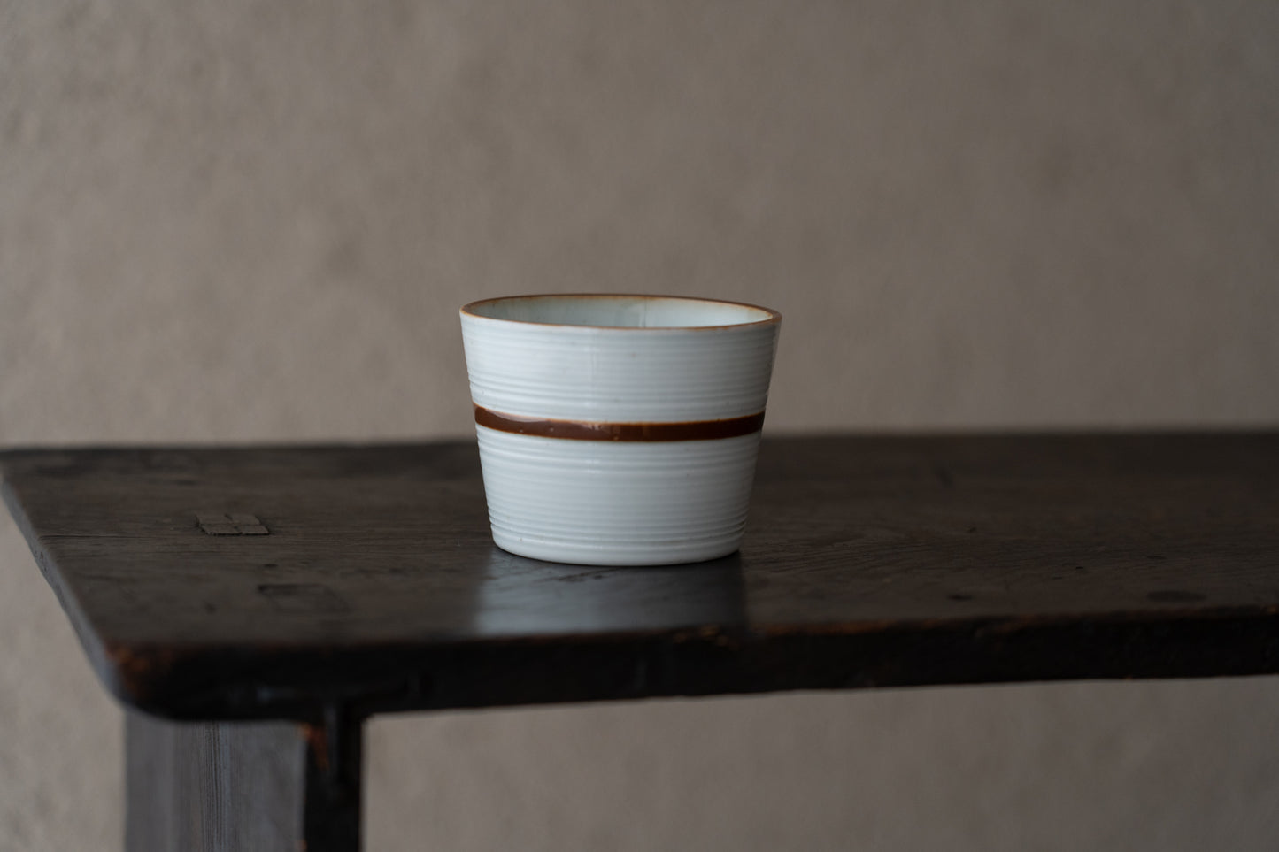 Old Imari sake cup with rust glazed line pattern