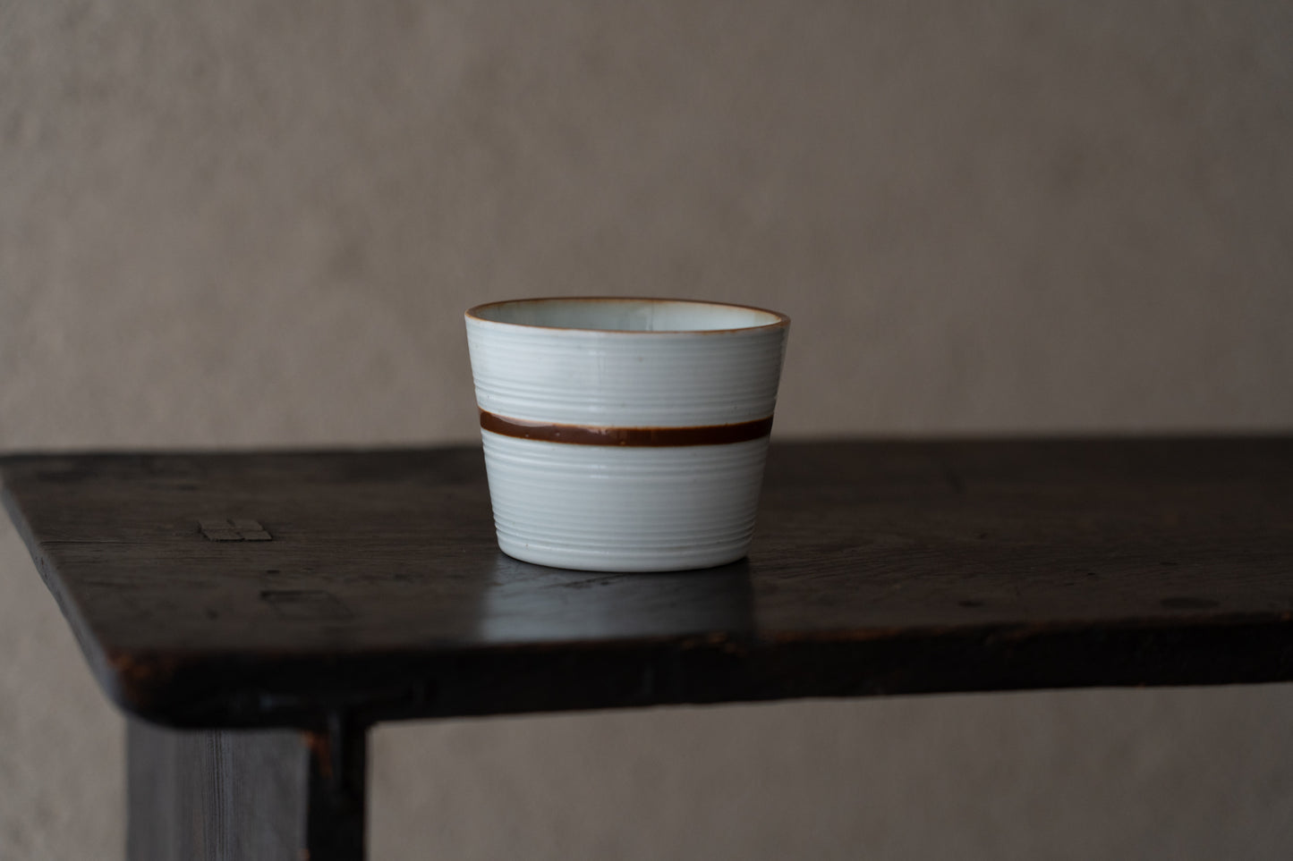 Old Imari sake cup with rust glazed line pattern