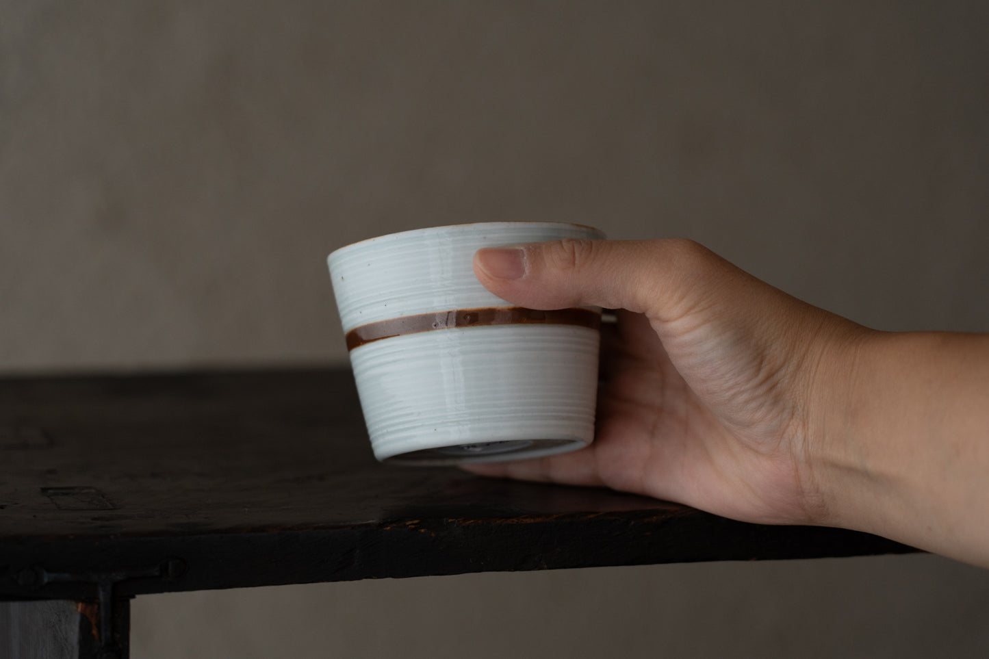 Old Imari sake cup with rust glazed line pattern