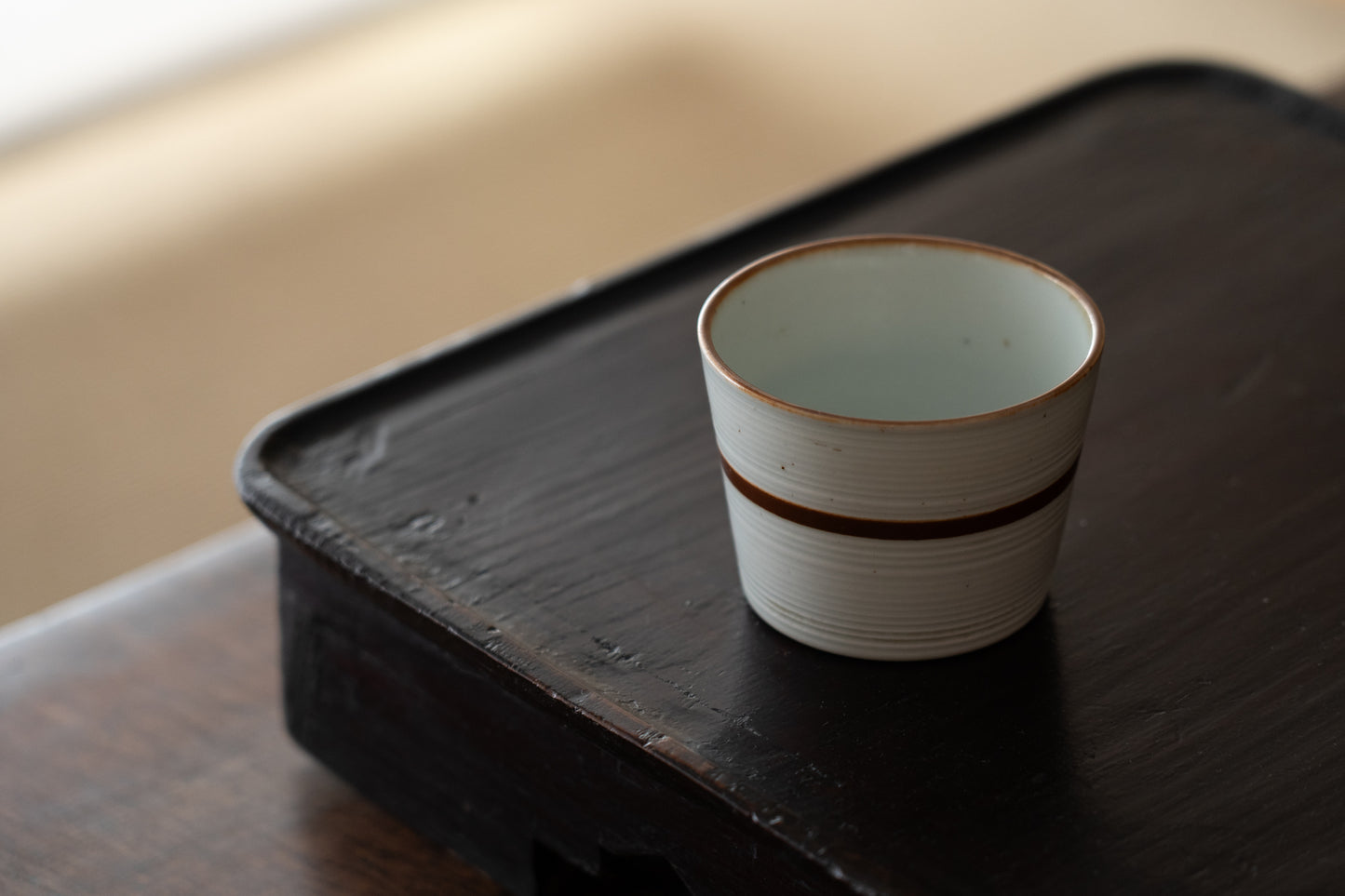 Old Imari sake cup with rust glazed line pattern