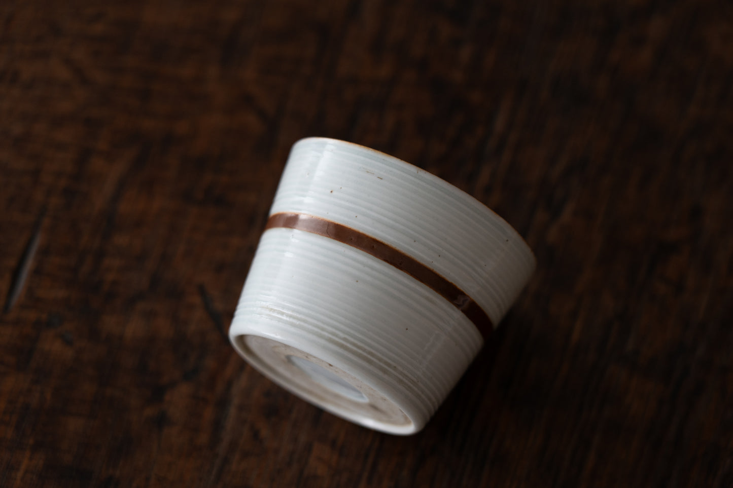 Old Imari sake cup with rust glazed line pattern