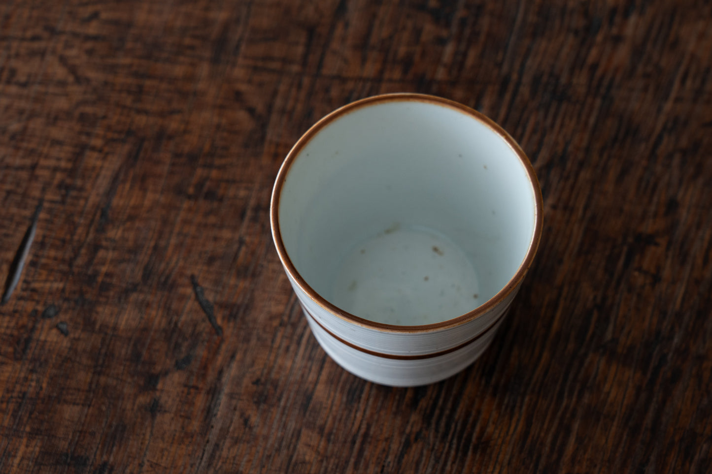 Old Imari sake cup with rust glazed line pattern