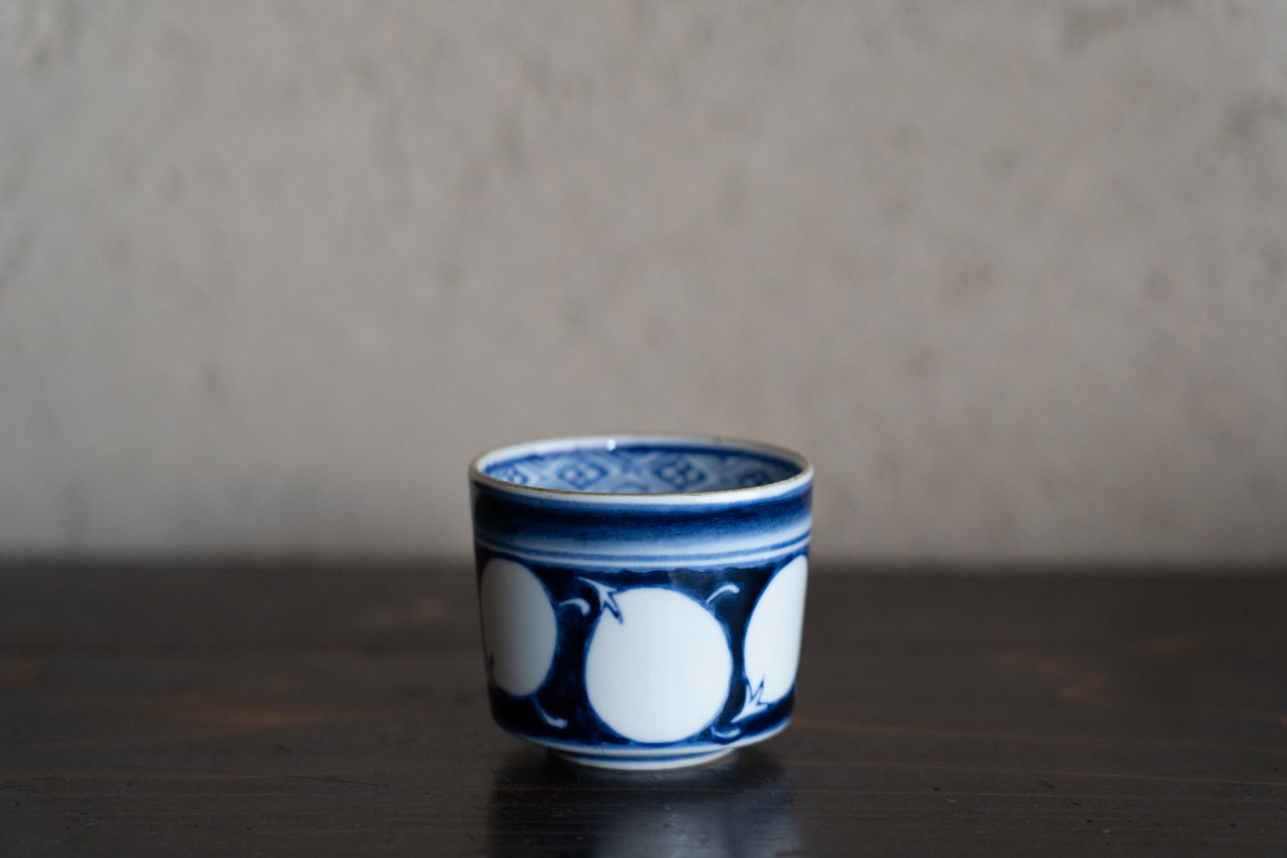 Old Imari sake cup with eggplant design
