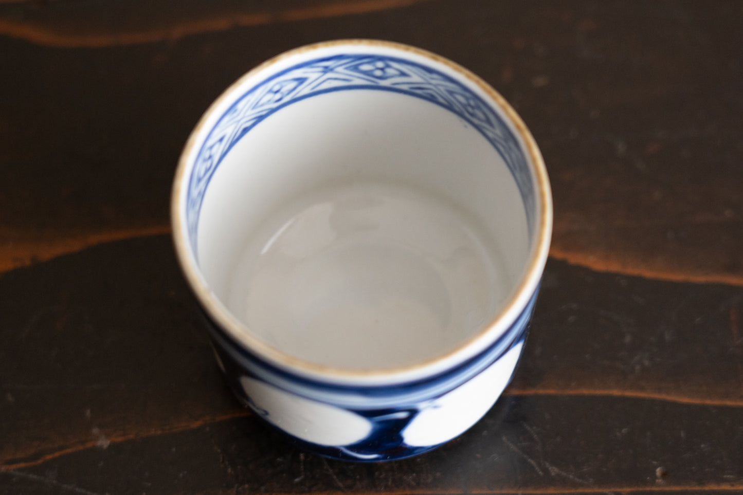 Old Imari sake cup with eggplant design