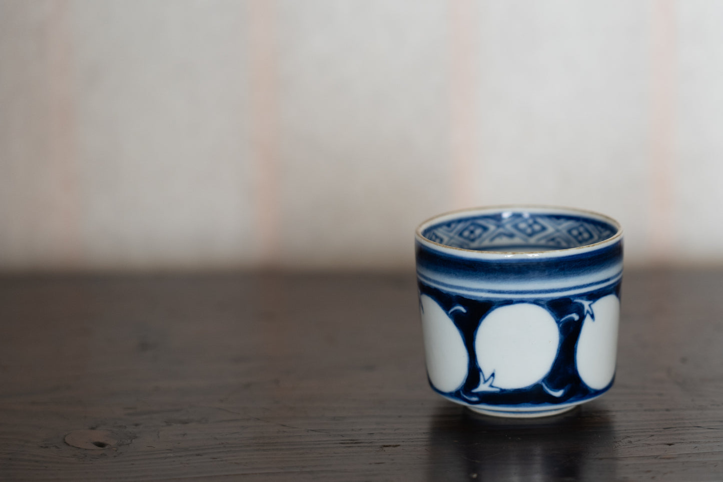 Old Imari sake cup with eggplant design