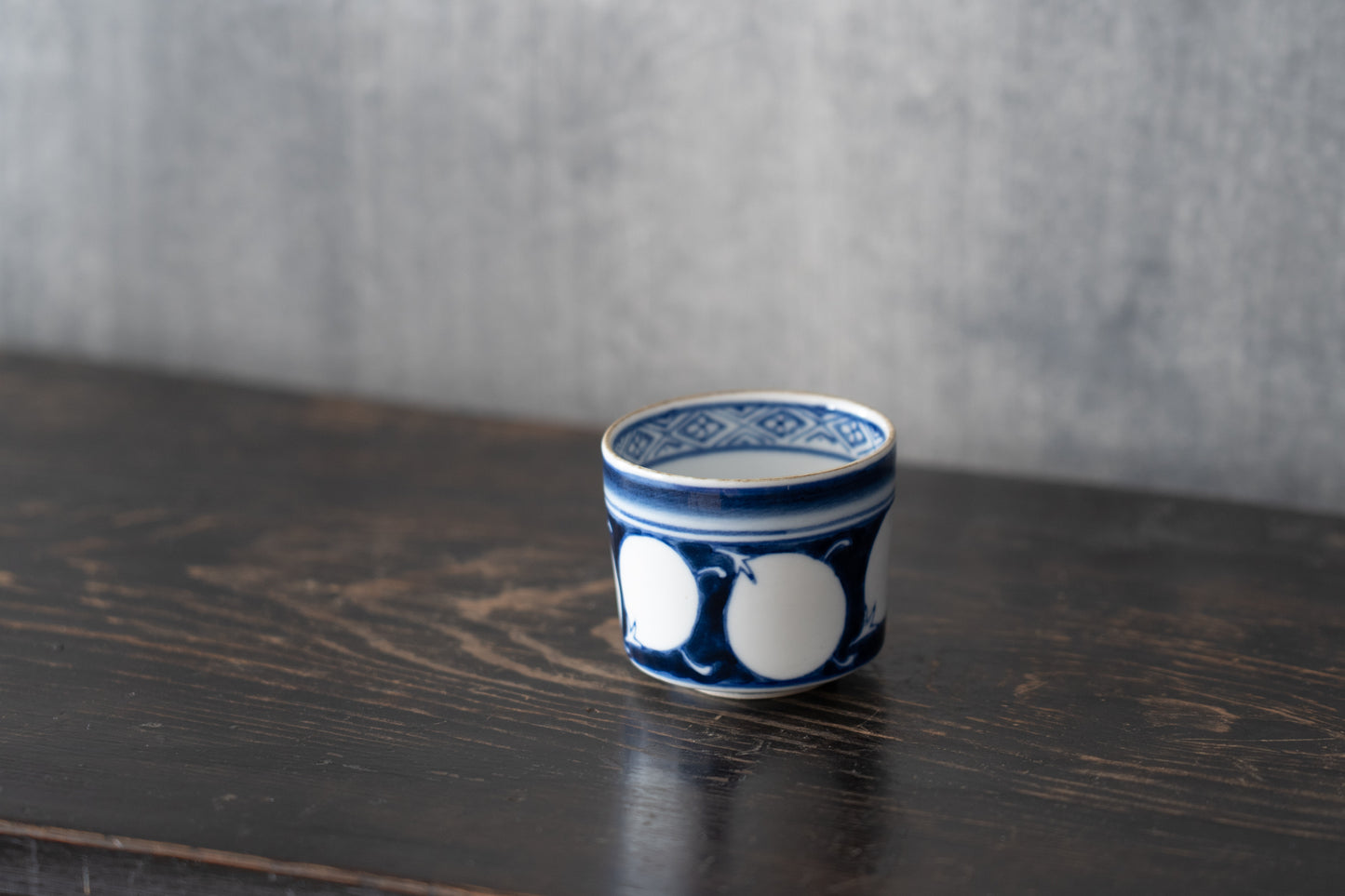 Old Imari sake cup with eggplant design