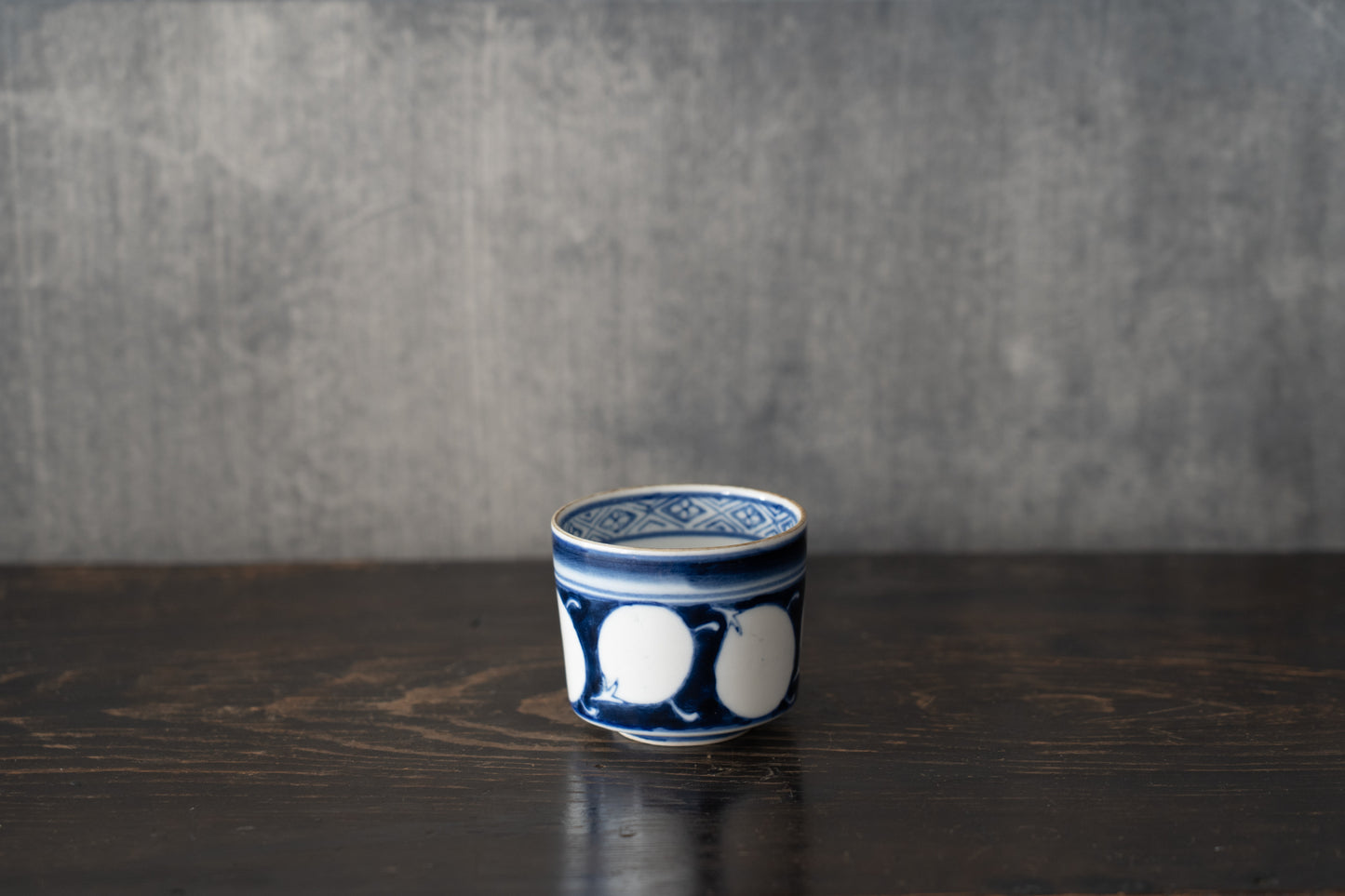Old Imari sake cup with eggplant design