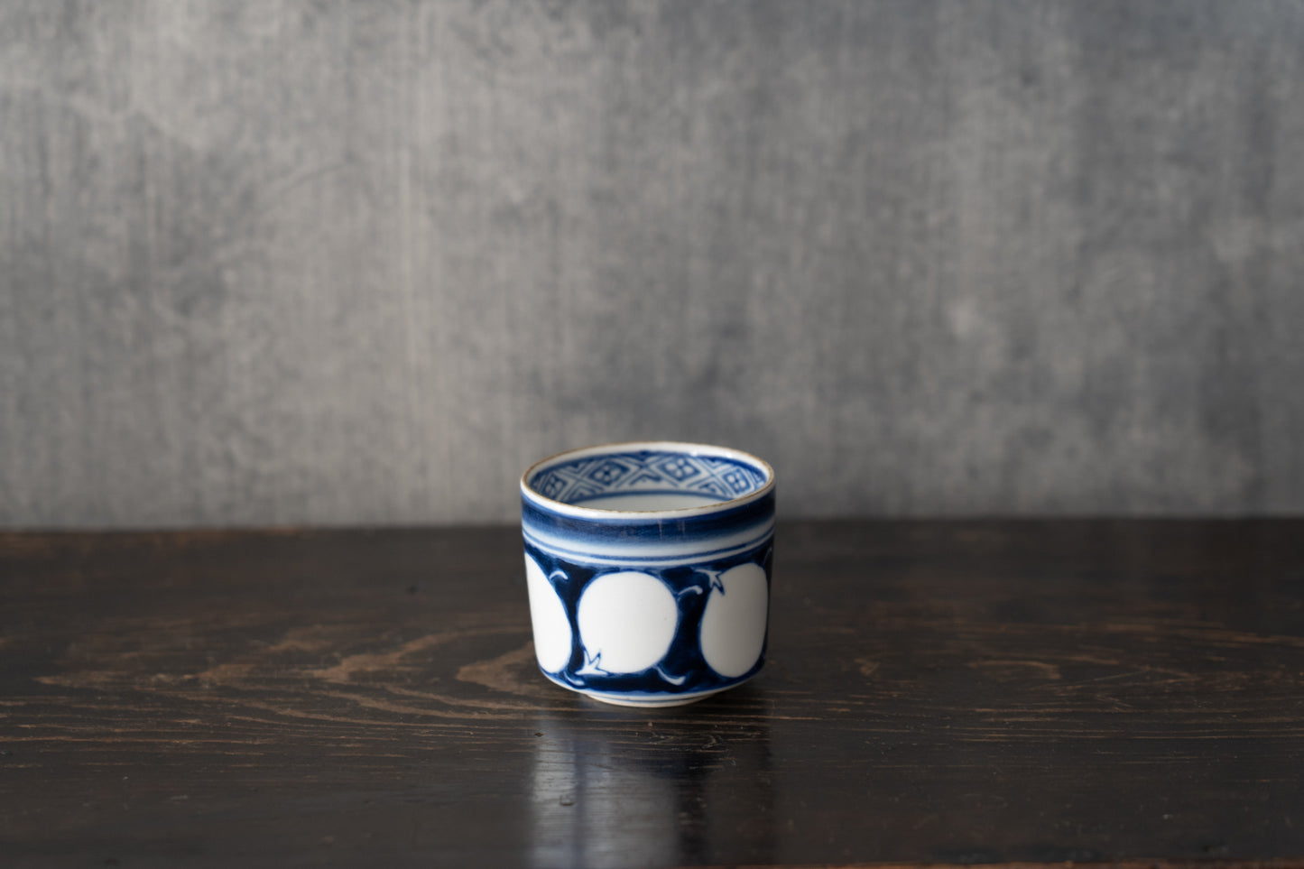 Old Imari sake cup with eggplant design
