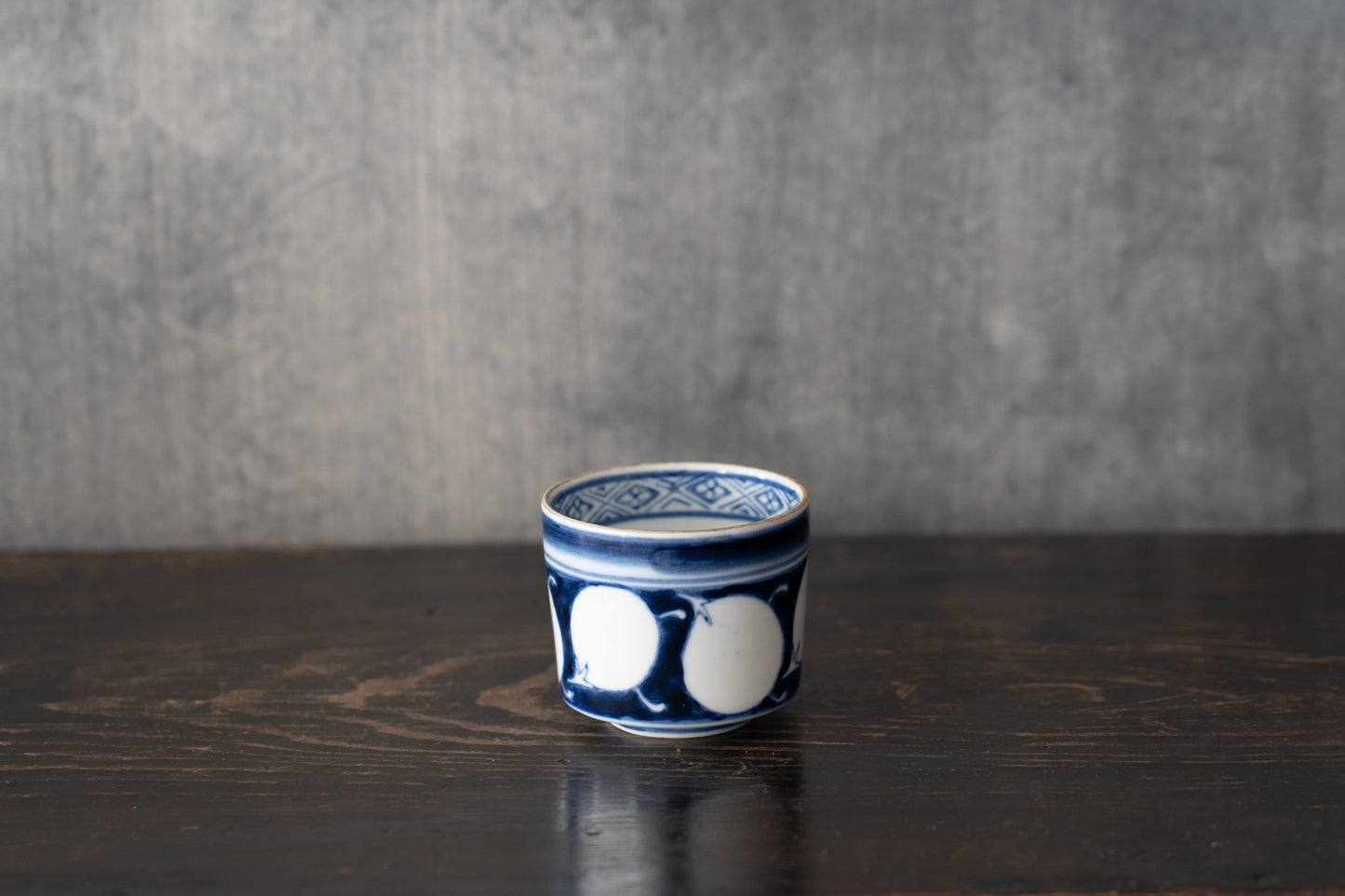Old Imari sake cup with eggplant design
