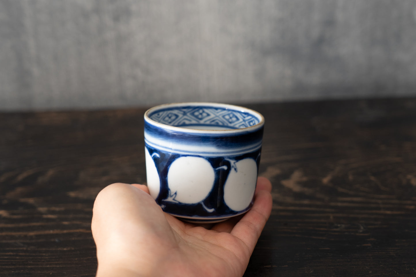 Old Imari sake cup with eggplant design