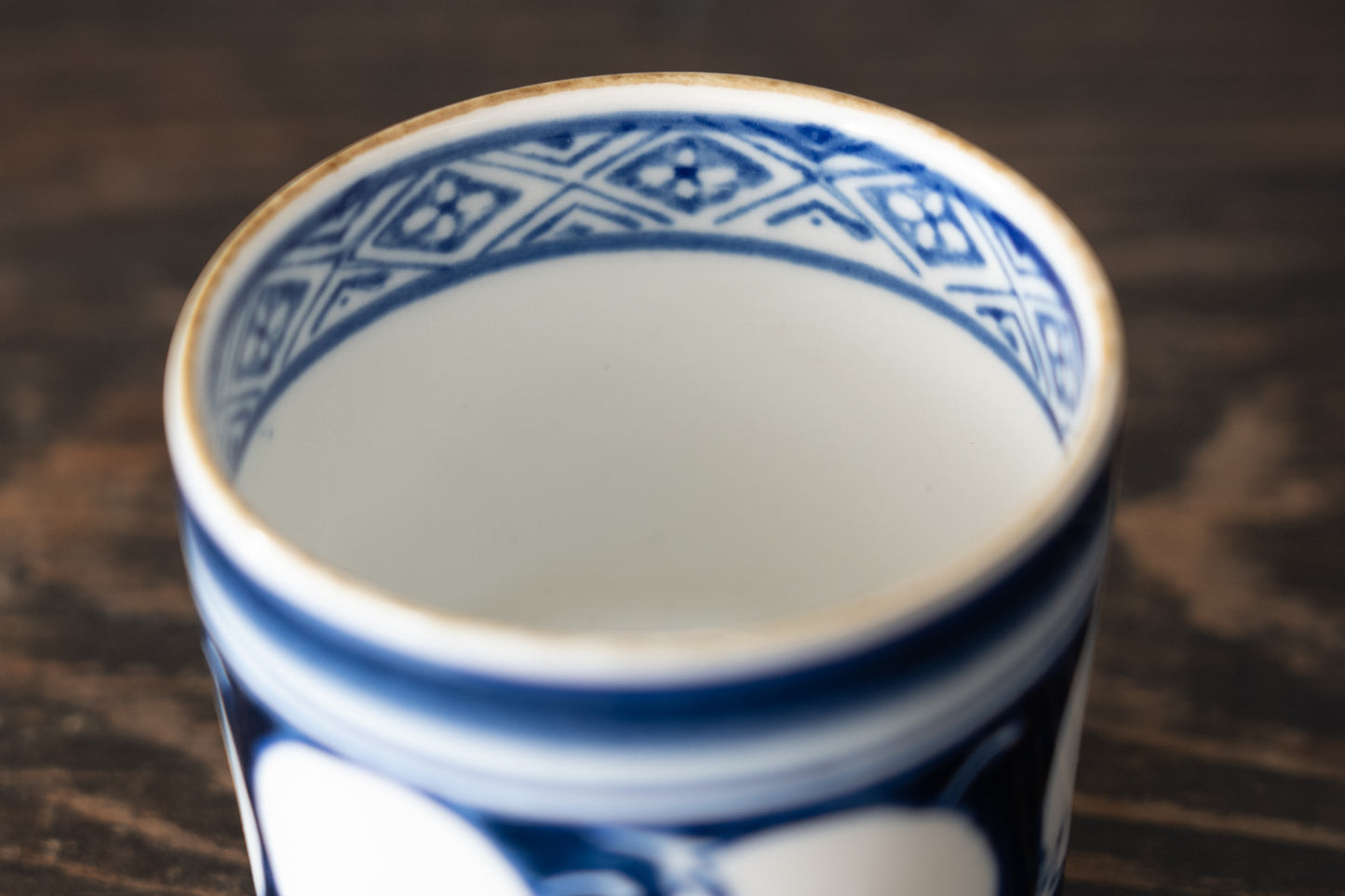 Old Imari sake cup with eggplant design