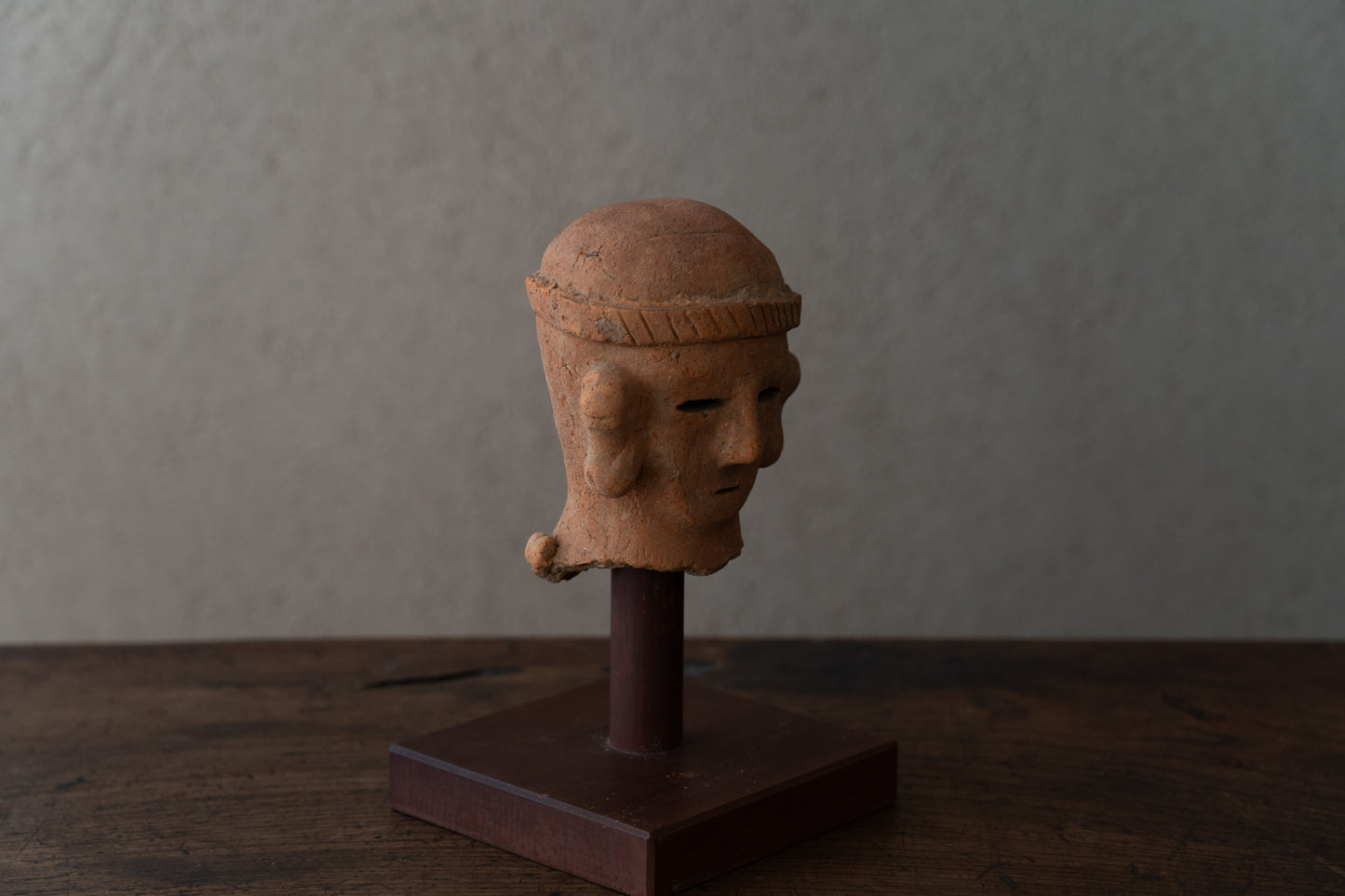 Haniwa male figure wearing a hat