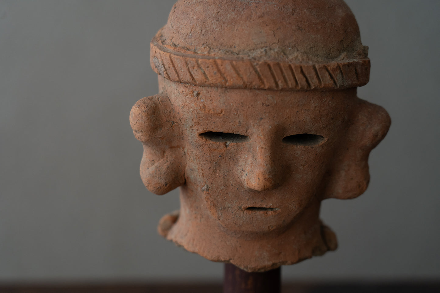 Haniwa male figure wearing a hat