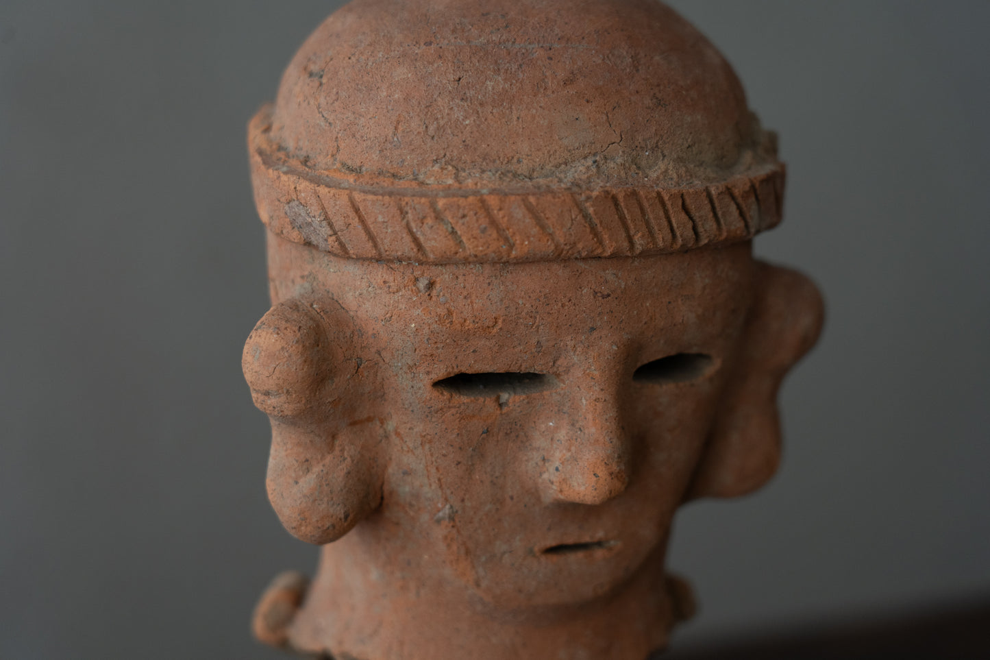 Haniwa male figure wearing a hat