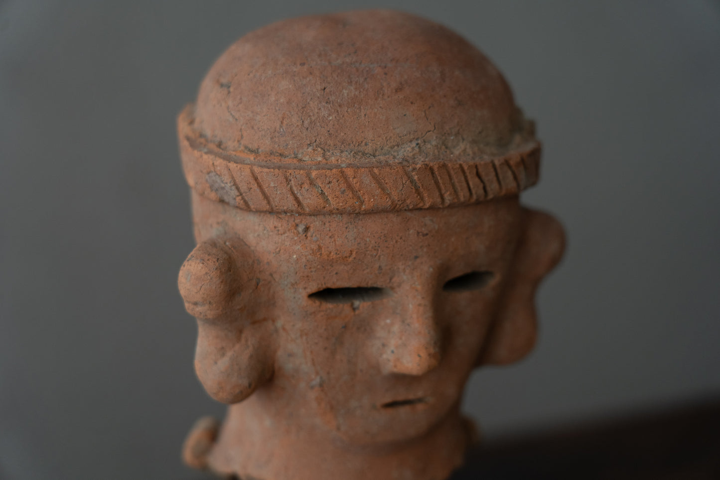 Haniwa male figure wearing a hat