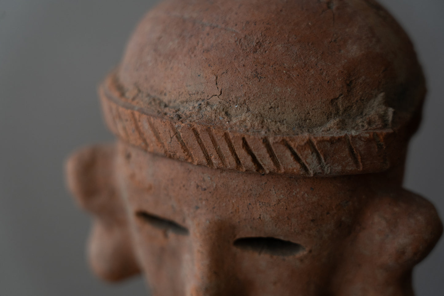 Haniwa male figure wearing a hat