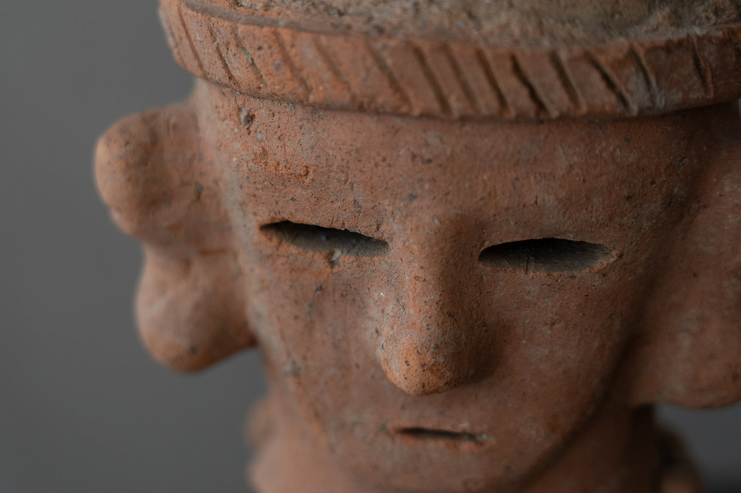 Haniwa male figure wearing a hat