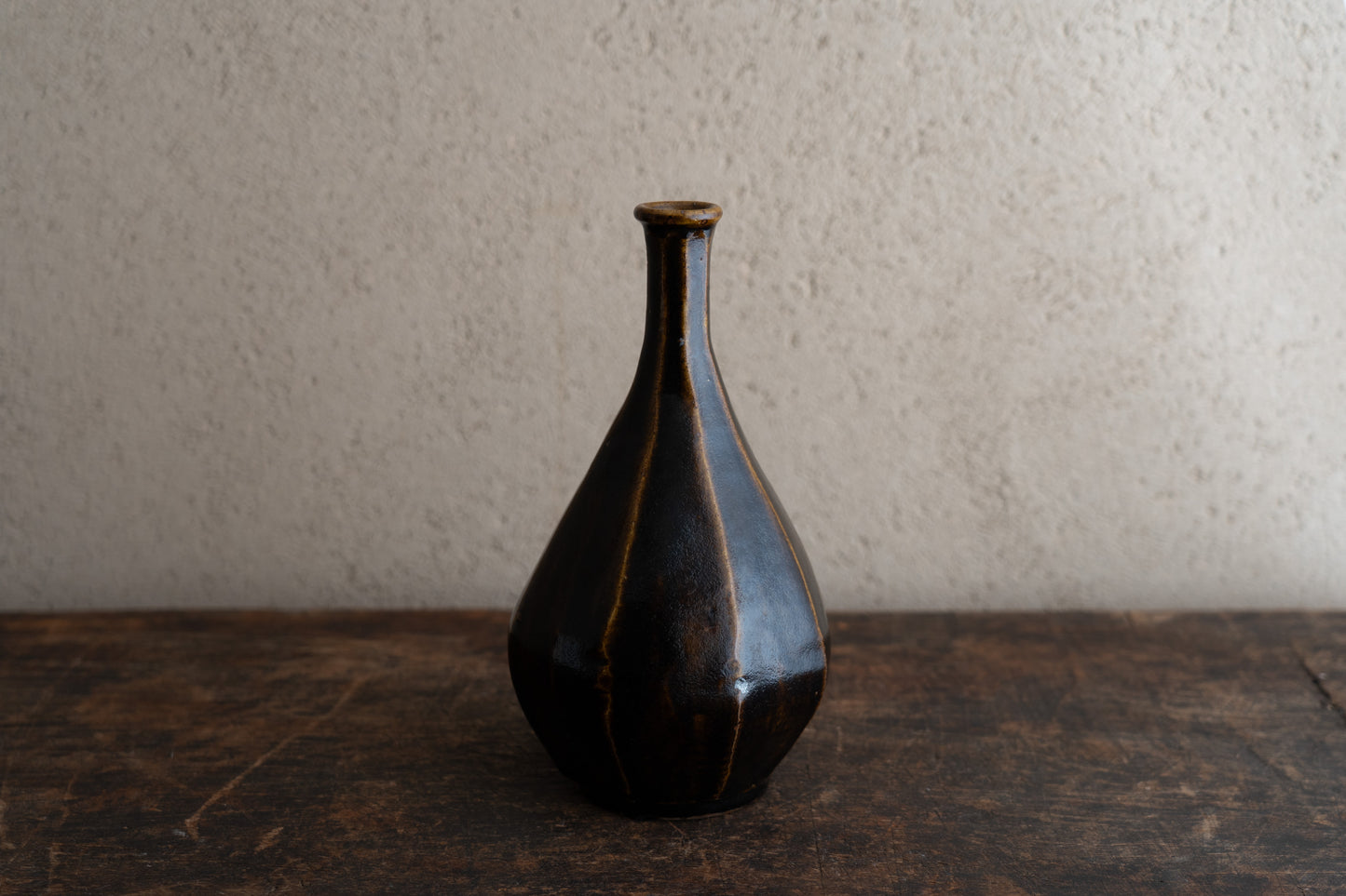 Amber glazed faceted bottle