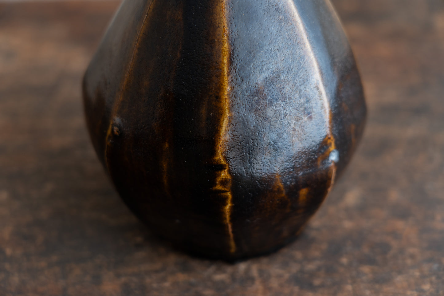 Amber glazed faceted bottle