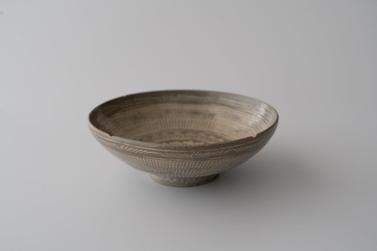 Buncheong bowl with stamped rope-curtain pattern