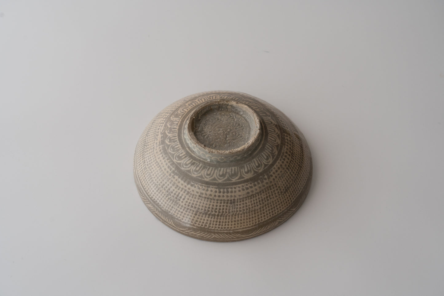 Buncheong bowl with stamped rope-curtain pattern