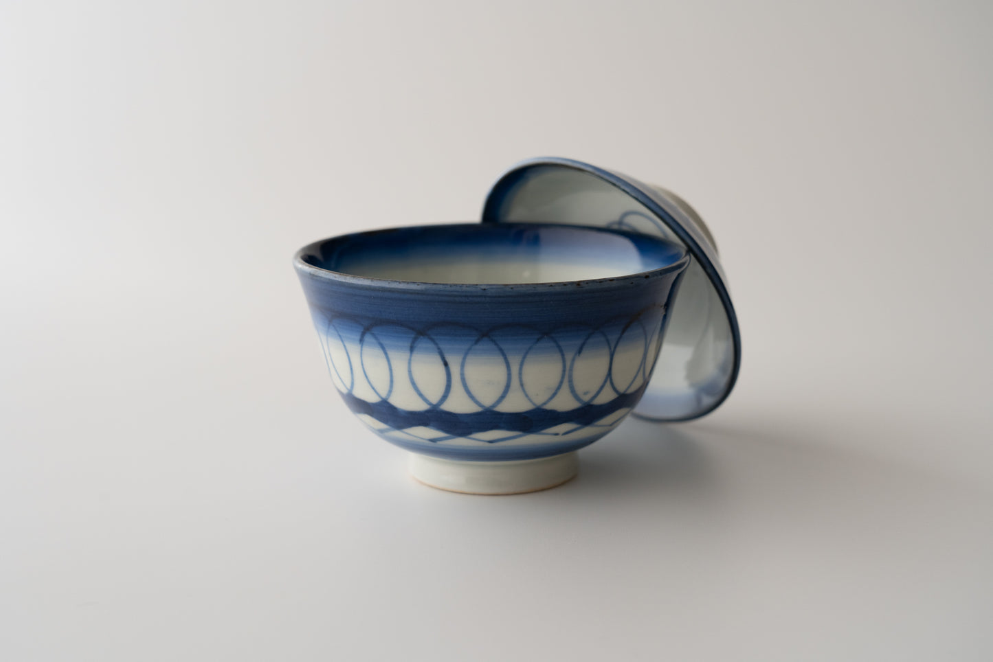 Old Imari tea bowl with a lid and a connecting pattern