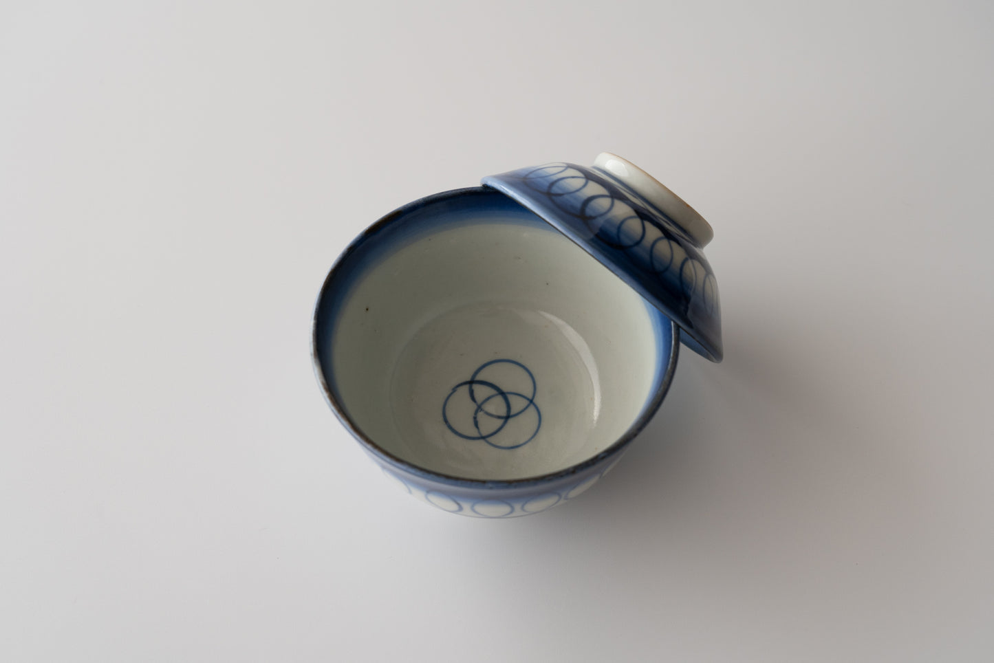 Old Imari tea bowl with a lid and a connecting pattern