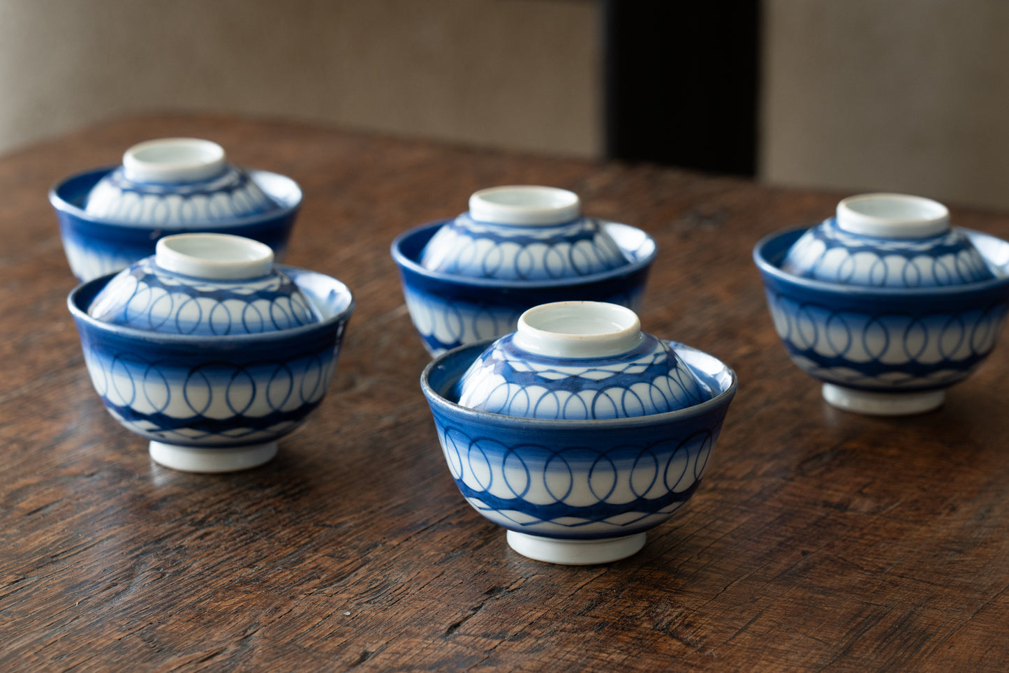 Old Imari tea bowl with a lid and a connecting pattern