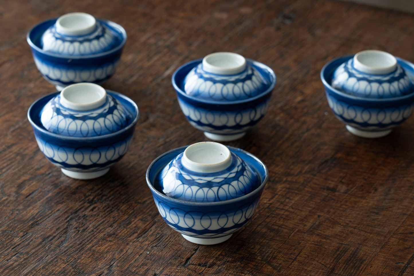 Old Imari tea bowl with a lid and a connecting pattern