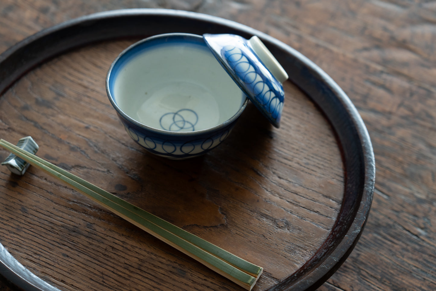 Old Imari tea bowl with a lid and a connecting pattern