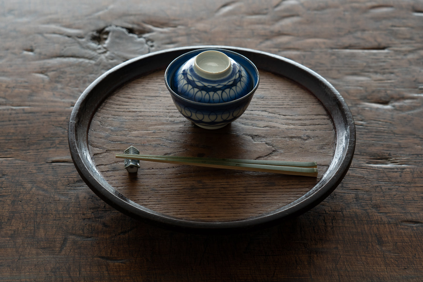 Old Imari tea bowl with a lid and a connecting pattern