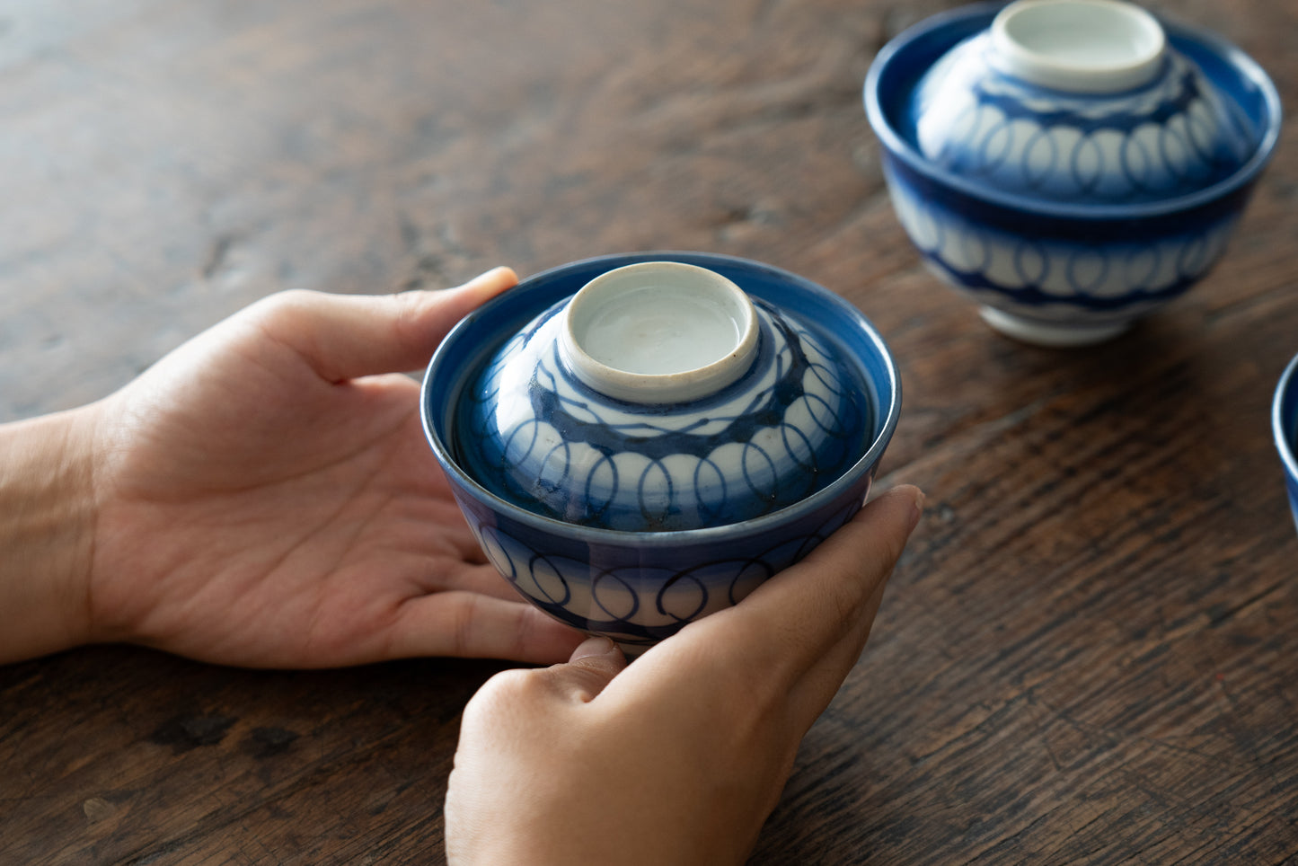 Old Imari tea bowl with a lid and a connecting pattern