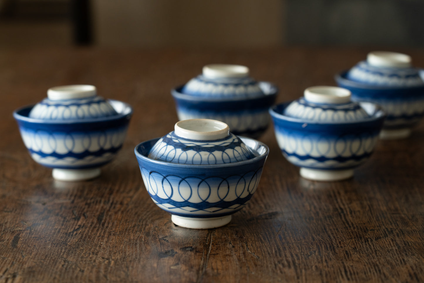 Old Imari tea bowl with a lid and a connecting pattern