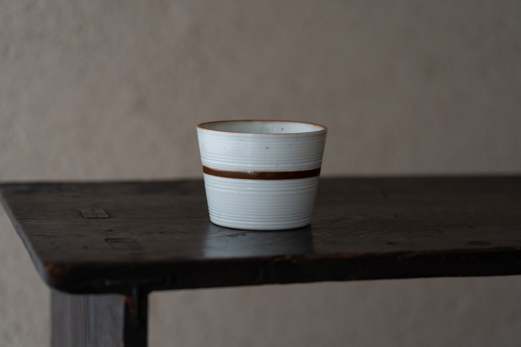 Old Imari sake cup with rust glazed line pattern