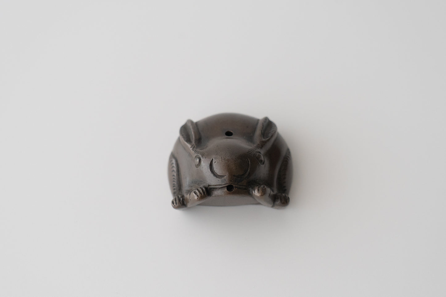 Old bronze water dropper in the shape of a rabbit