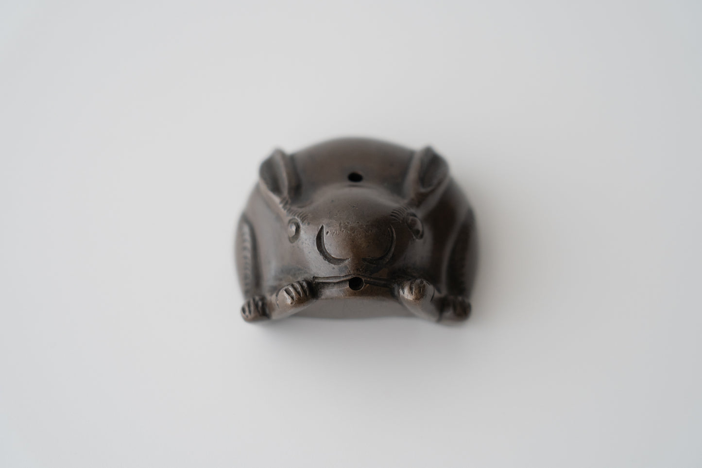 Old bronze water dropper in the shape of a rabbit