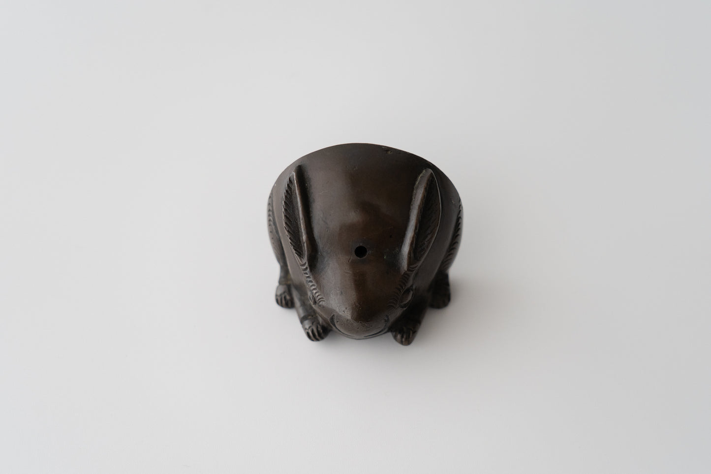 Old bronze water dropper in the shape of a rabbit