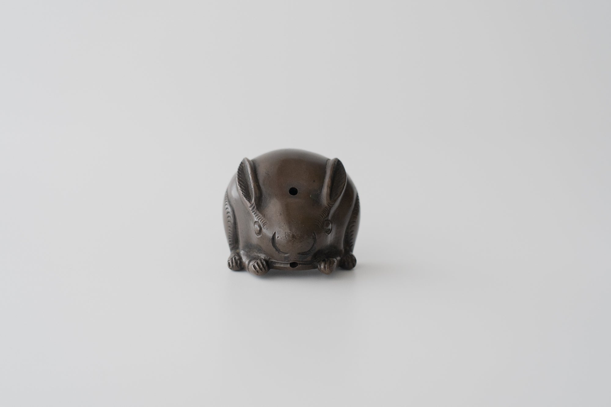 Old bronze water dropper in the shape of a rabbit