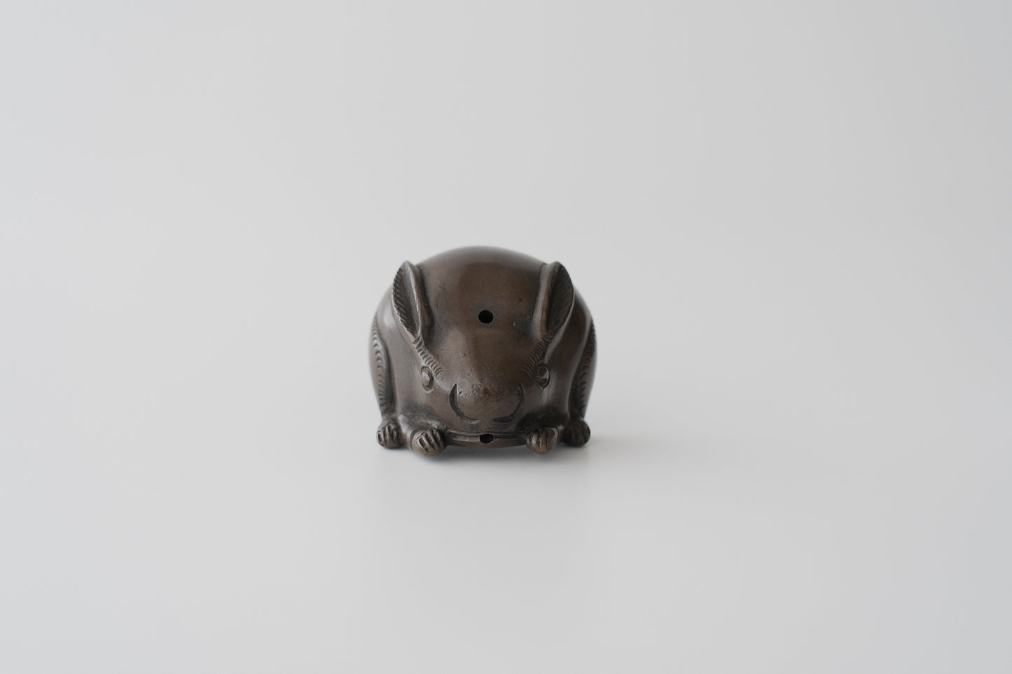 Old bronze water dropper in the shape of a rabbit