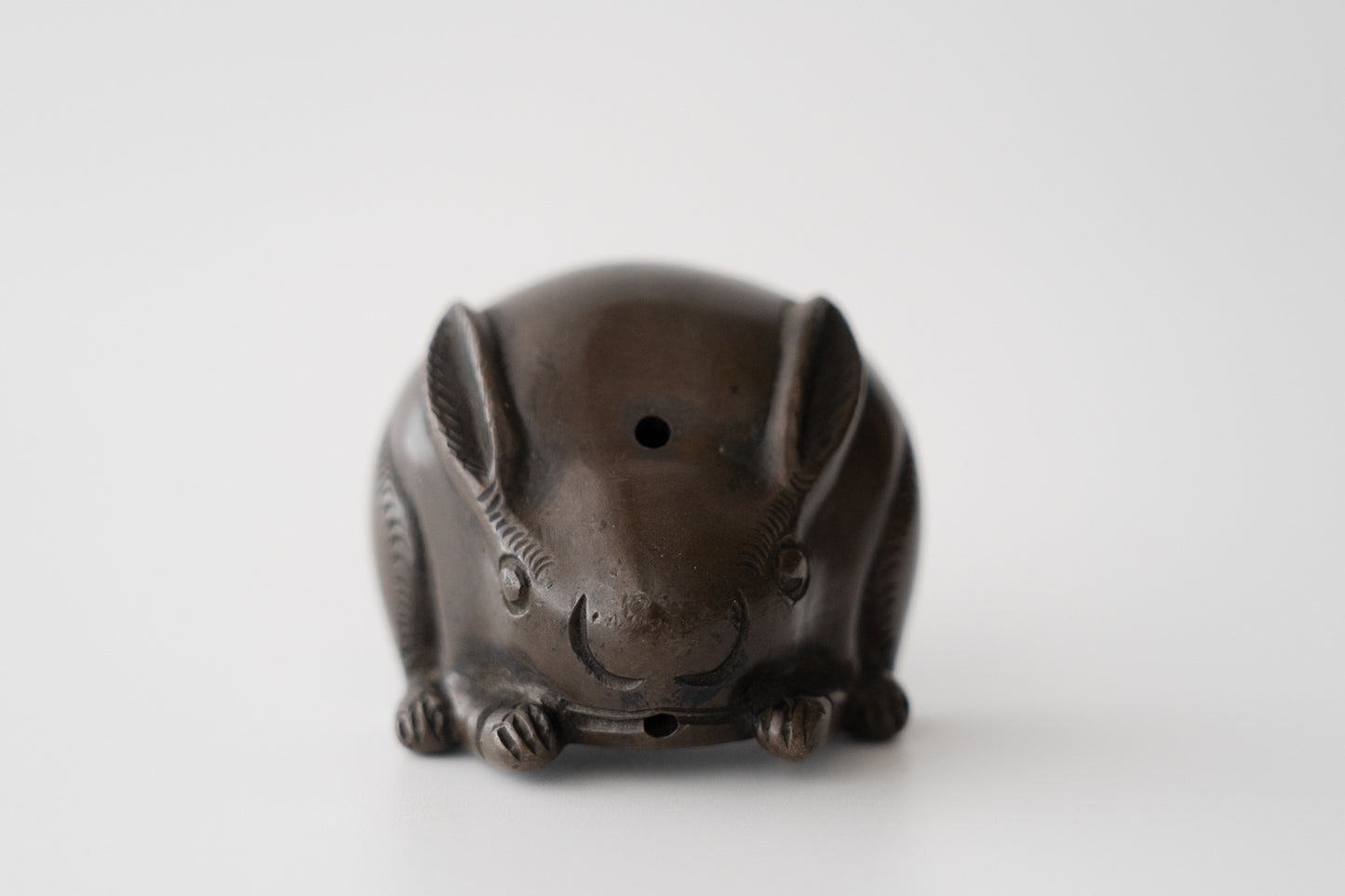 Old bronze water dropper in the shape of a rabbit