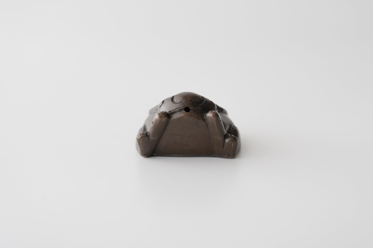 Old bronze water dropper in the shape of a rabbit