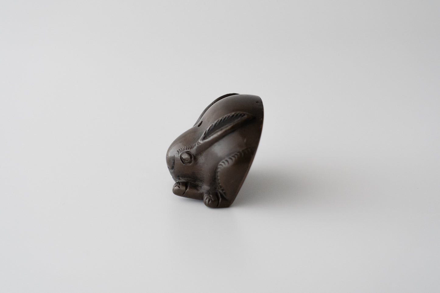 Old bronze water dropper in the shape of a rabbit