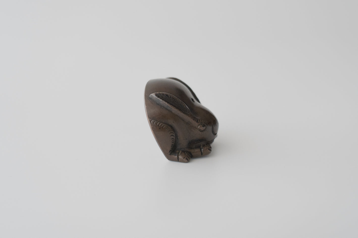 Old bronze water dropper in the shape of a rabbit