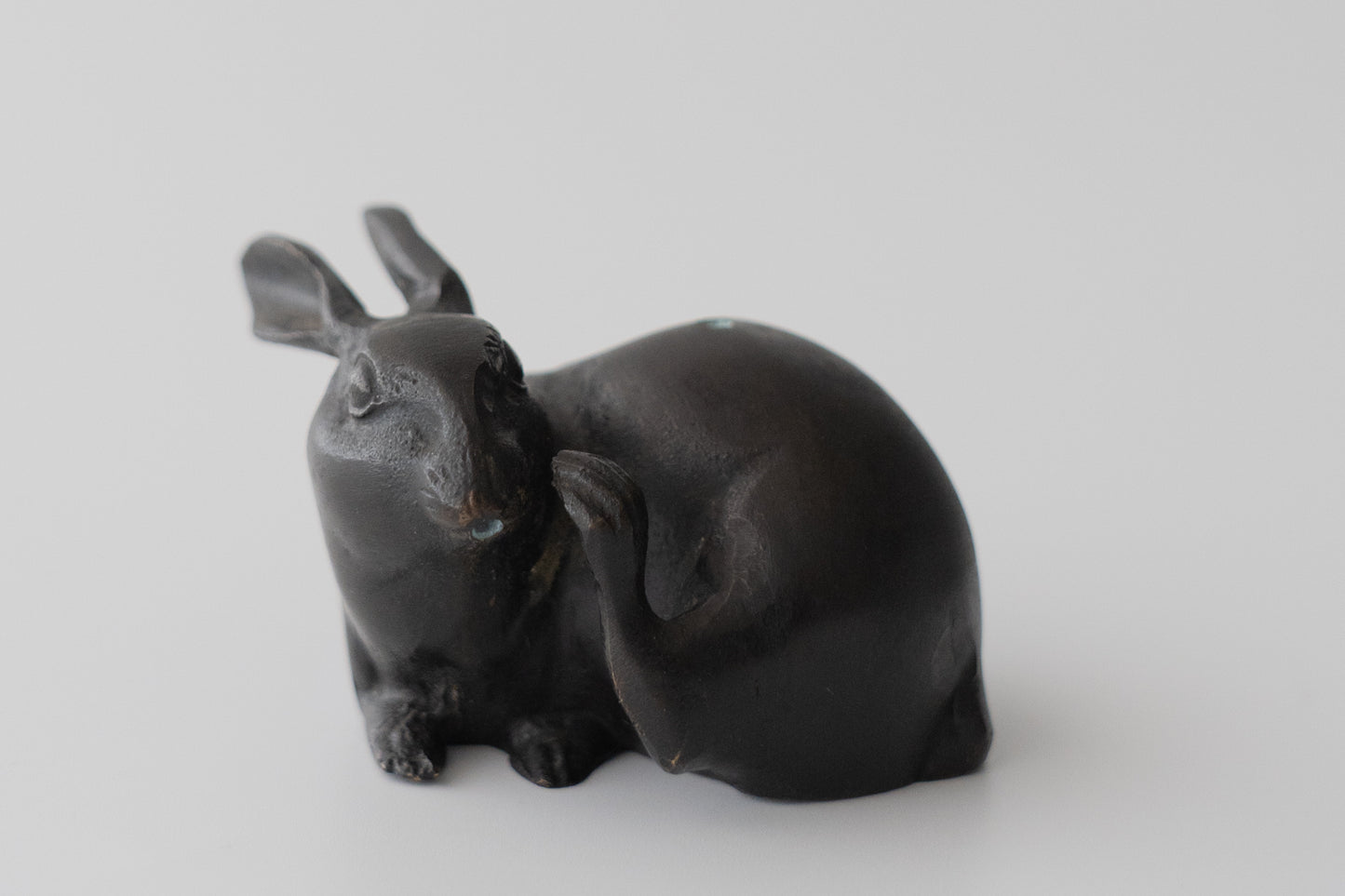 Old bronze water dropper in the shape of a rabbit