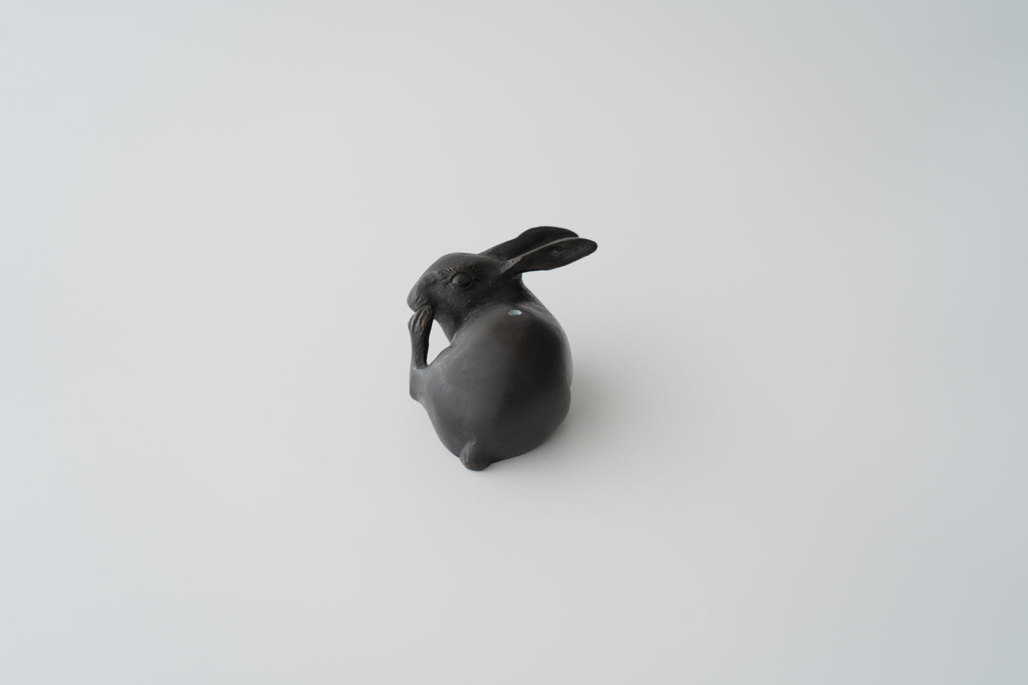 Old bronze water dropper in the shape of a rabbit