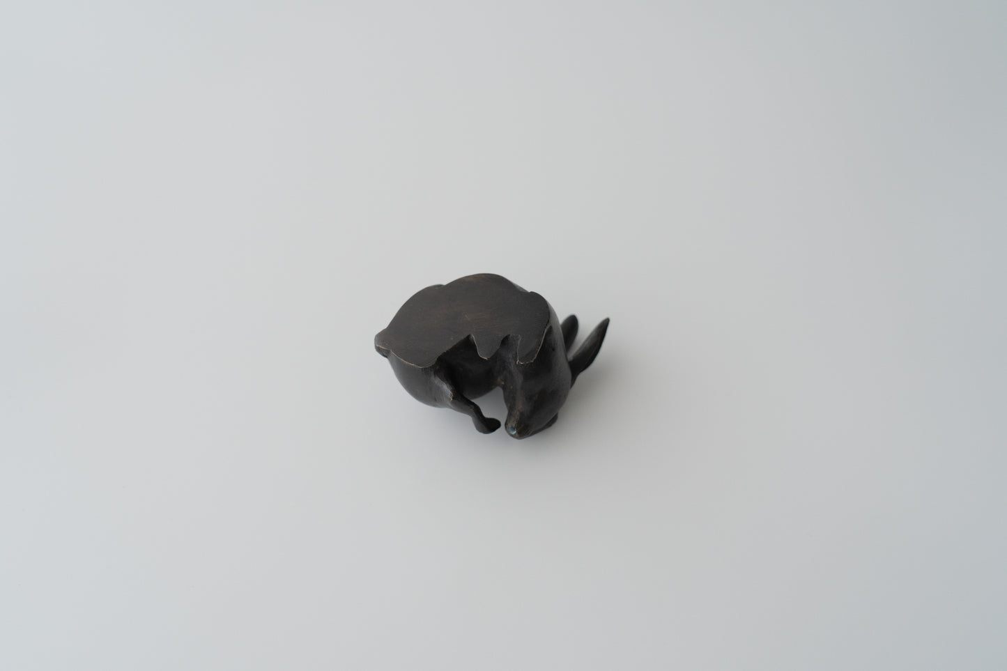 Old bronze water dropper in the shape of a rabbit